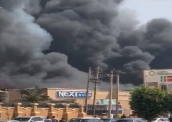 Nigerians Loot NEXT Supermarket in Abuja After It Was Gutted by Fire (Video)
