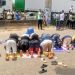 ASUU Strike: Photos Of Protesting OAU Students Praying On The Road As ASUU Members Join Protest