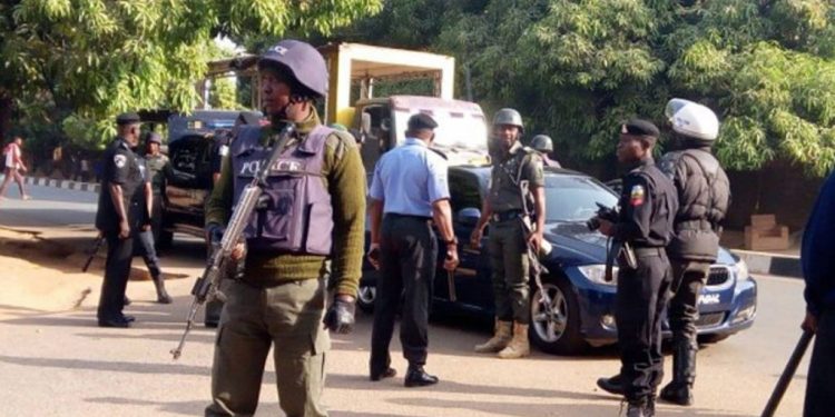 Drama As Police Arrest Nigerian Pastor And His Son In Abuja