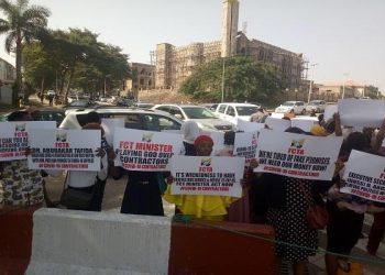 BREAKING: Tension As COVID-19 Contractors Protest In Abuja