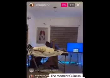 TRENDING VIDEO: Nigerian Lady Attempting To Set Guinness World Record For Longest Massage-a-thon Collapses