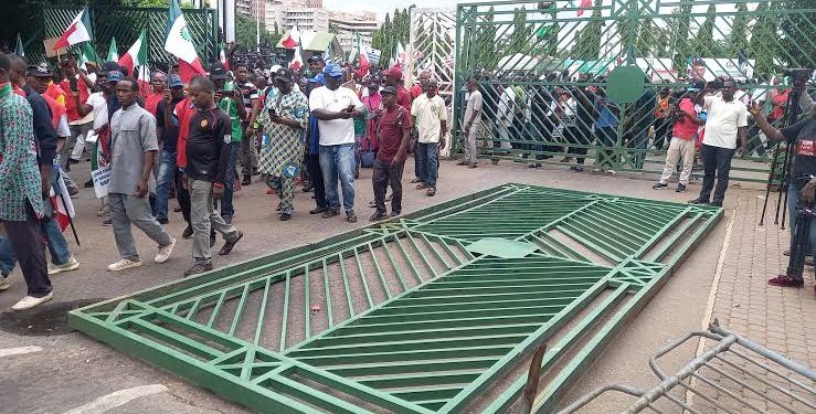 VIDEO: Angry NLC Protesters Break NASS Gate, Takeover Premises